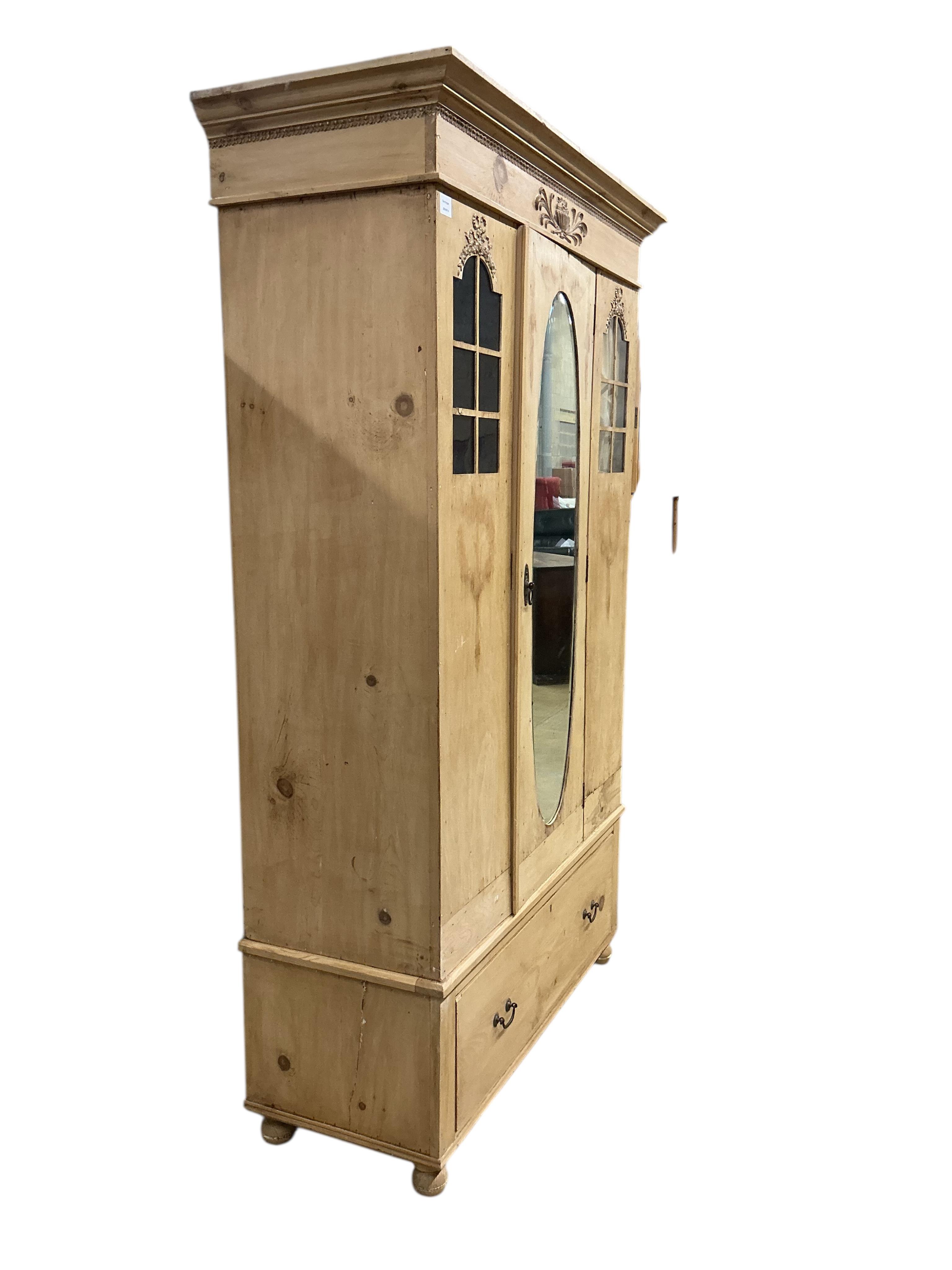 A late 19th century Continental pine wardrobe, width 124cm, depth 51cm, height 200cm